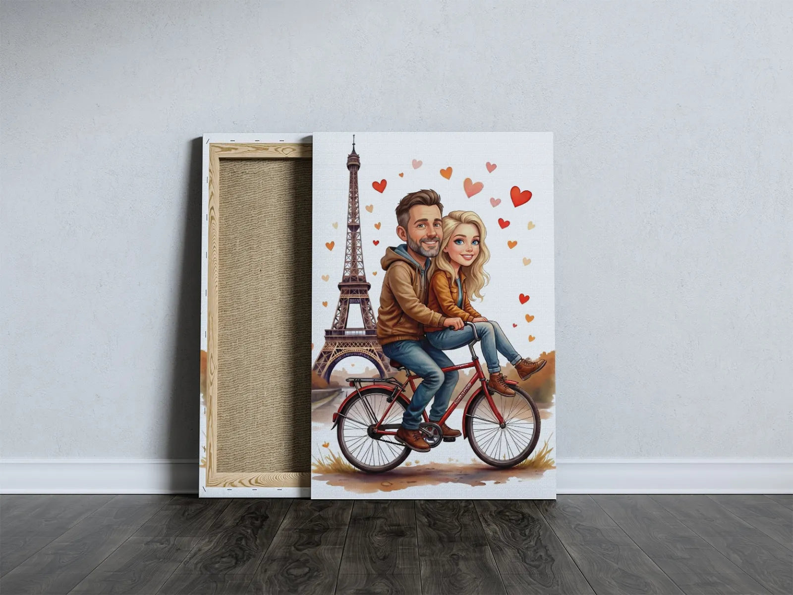 Karykatura pary na rowerze z wieżą Eiffla i serduszkami