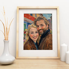 Framed portrait painting of a smiling couple in the style of outdoor painting